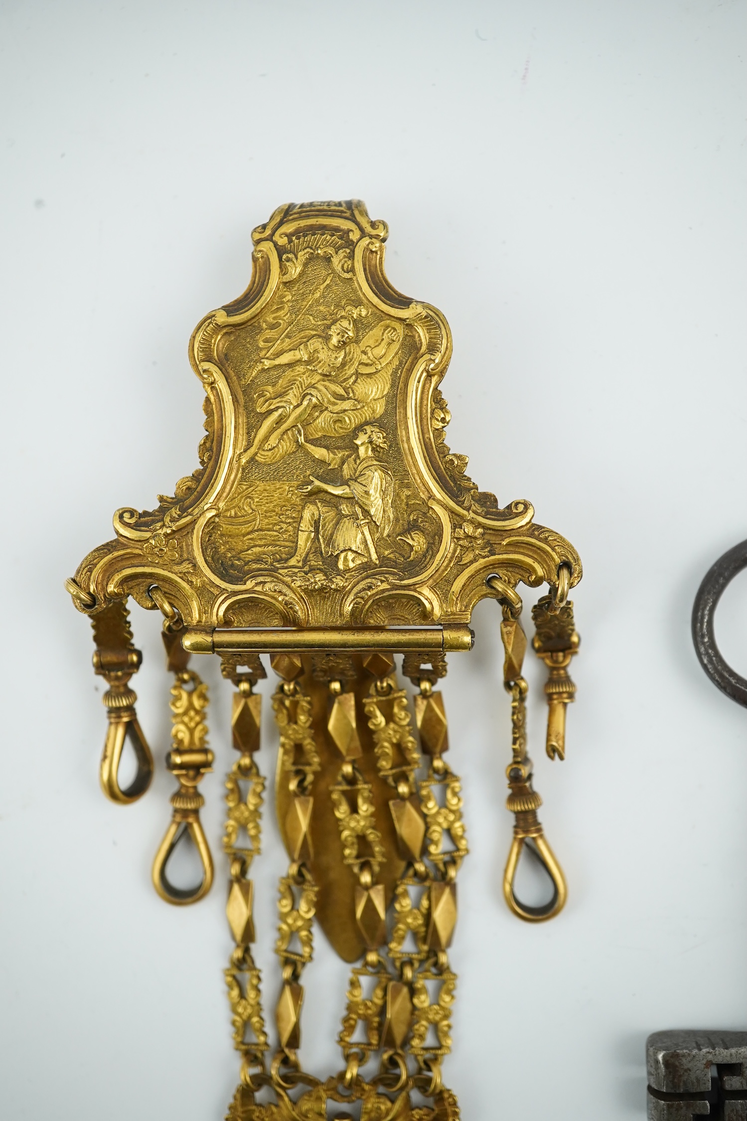 A late 18th century German gilt metal chatelaine and a steel key, chaterlaine 14cm long. Condition - a link is missing on one chain